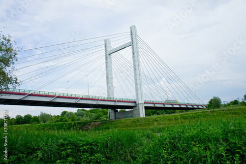 Big handsome cable-stayed bridge over the river against the sky © Pavlo