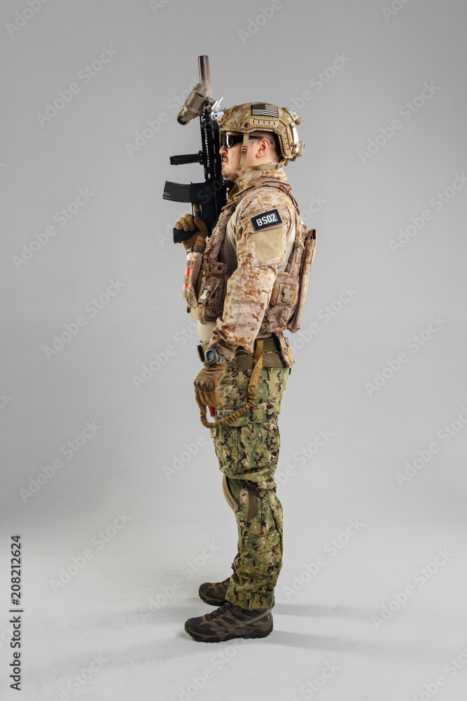 Special forces soldier with rifle on white background. Special forces soldier with rifle on white background.