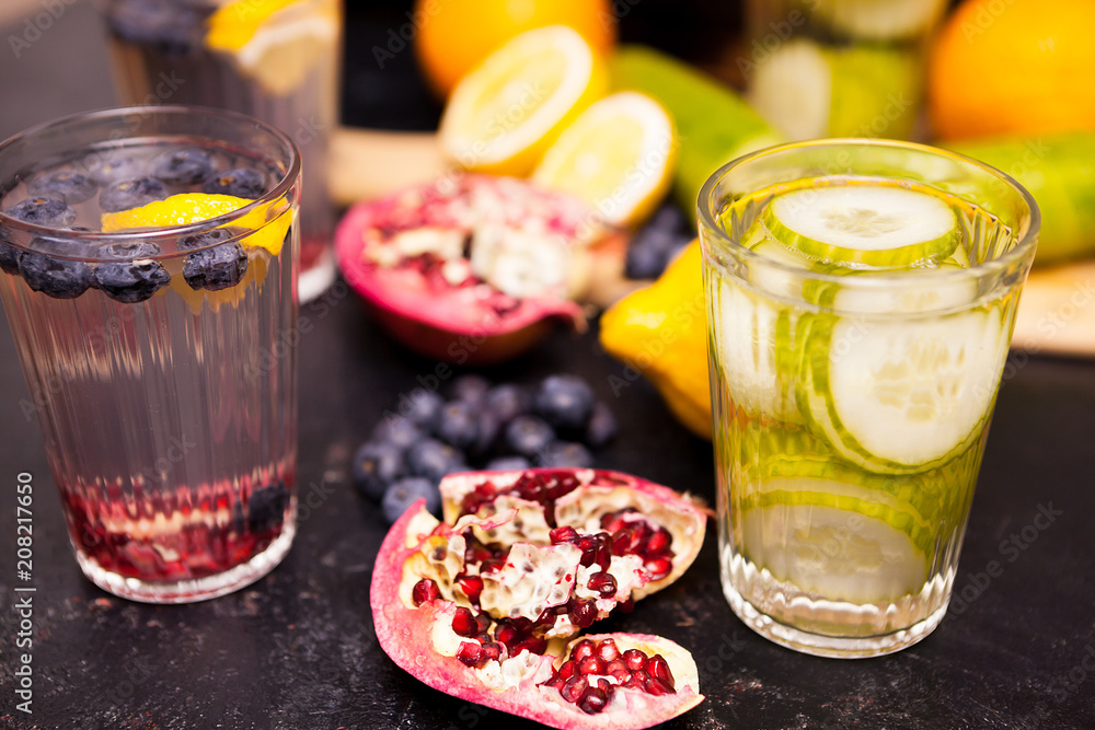 Healthy and delicious detox water next to fruits it was made of Healthy and delicious detox water next to fruits it was made of