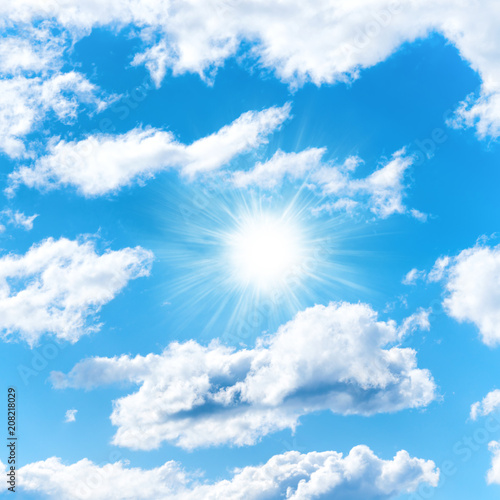 Sun on blue sky with clouds as nature background