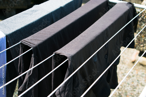 Laundry line with clothes outdoors photo