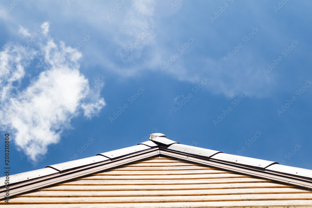 housetop roof blue sky white cloud background