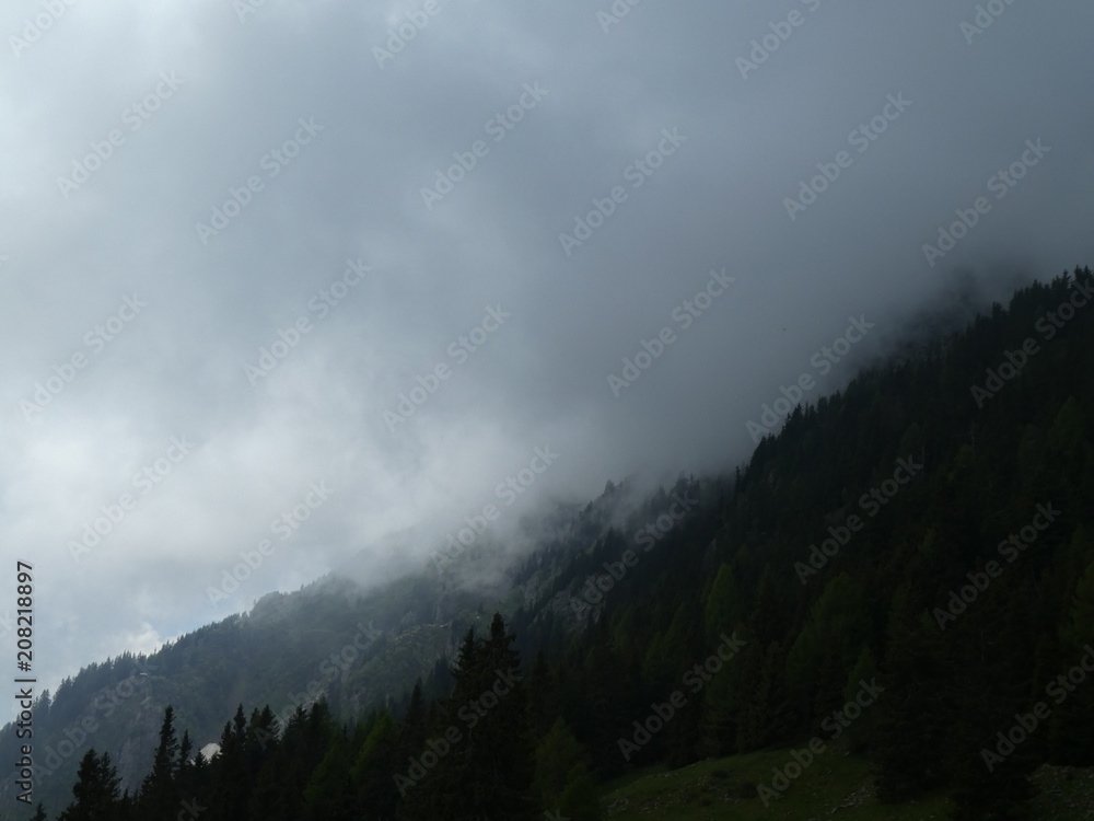 landscape of the mountains in south tyrol italy alps europe with bad weather fog