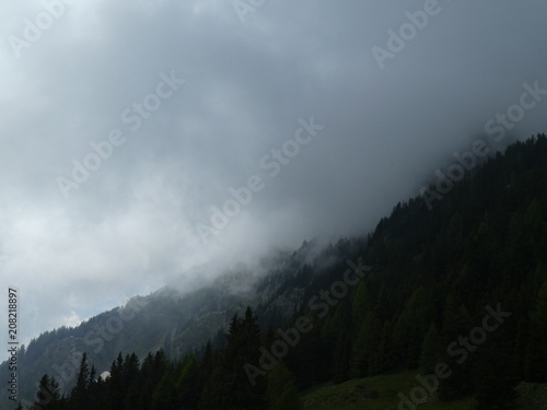 landscape of the mountains in south tyrol italy alps europe with bad weather fog © Sonja
