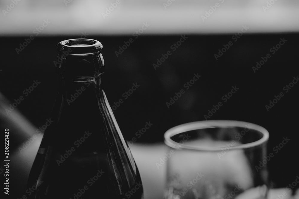 Beer bottle and a glass standing together