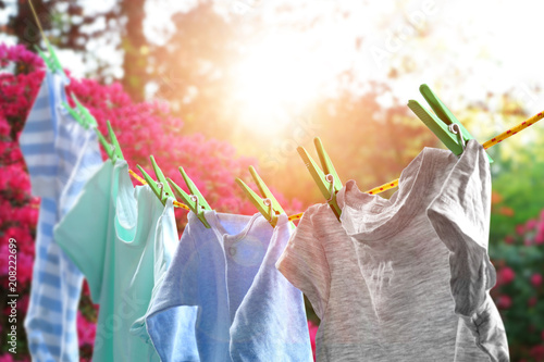 Rope with clean clothes outdoors on laundry day