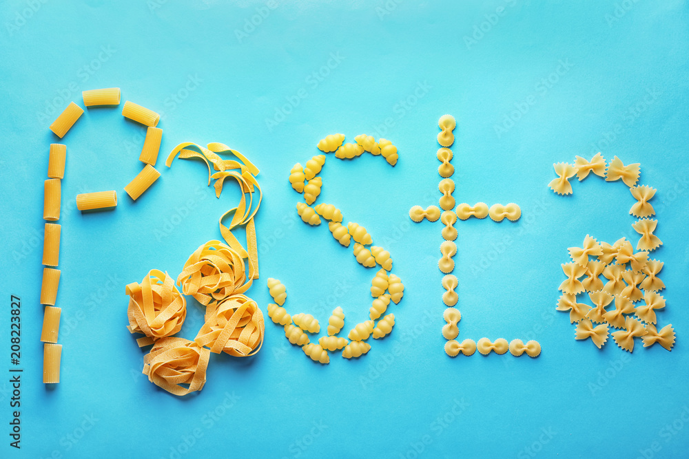 Obraz premium Flat lay composition with different uncooked pasta on color background