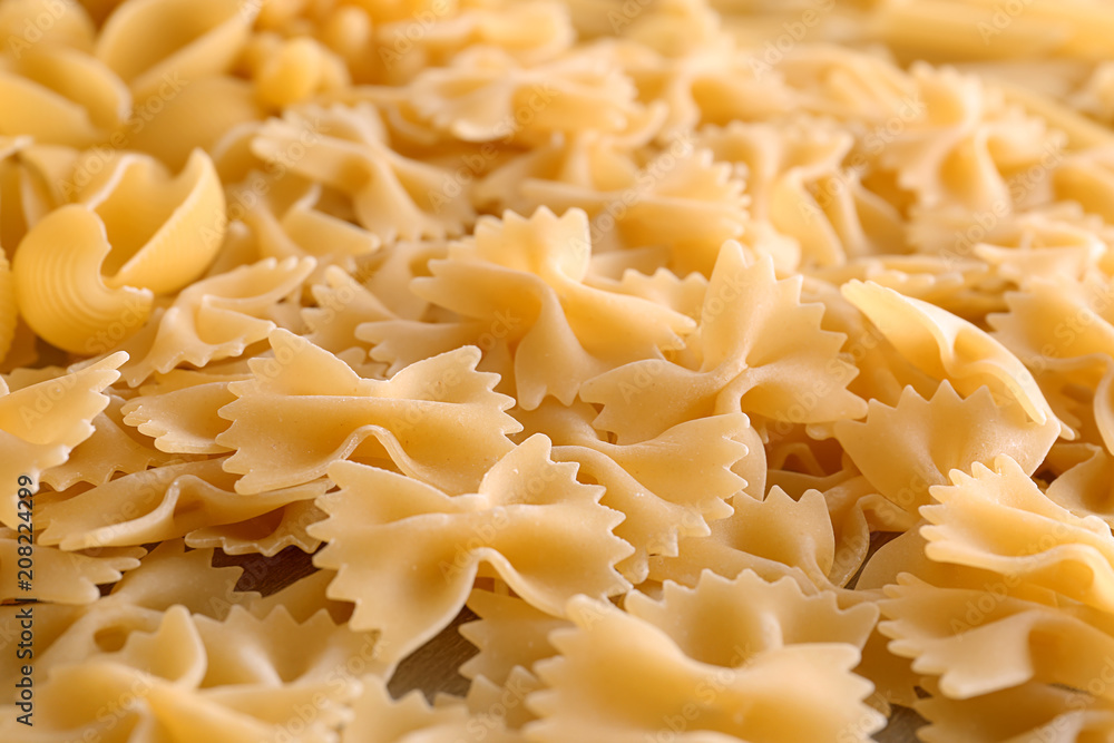 Uncooked pasta as background, closeup Uncooked pasta as background, closeup