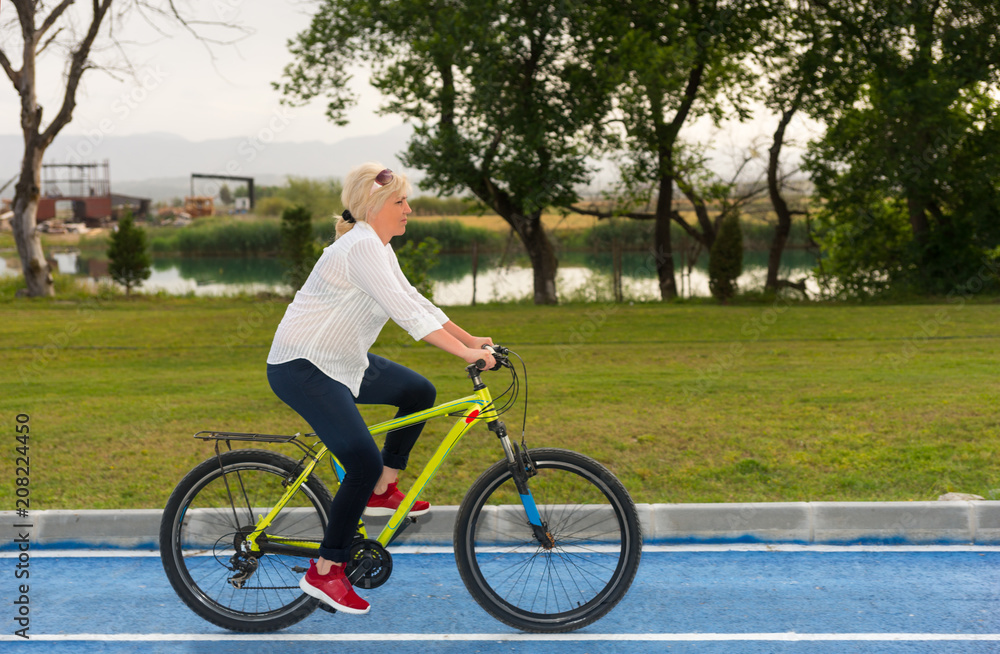 Fit healthy woman riding her bicycle