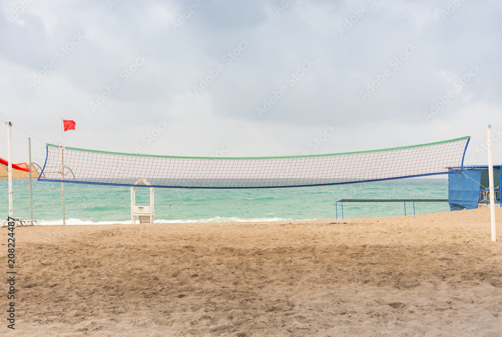 Volley ball net on a deserted tropical beach Volley ball net on a deserted tropical beach