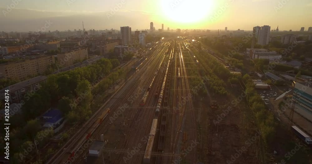 The railway at sunset. Running train. The railway at sunset. Running train.