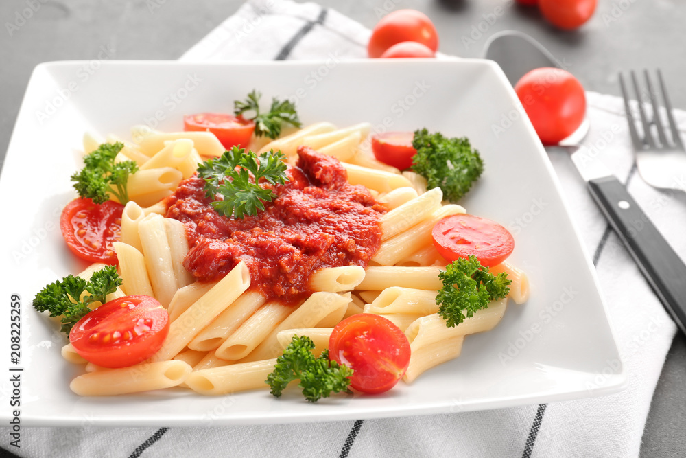 Plate of delicious pasta with bolognese sauce on table, closeup Plate of delicious pasta with bolognese sauce on table, closeup