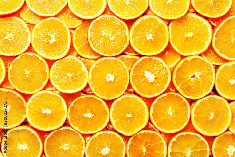 Creative pattern. Fresh sliced orange fruit texture. Macro, top view with copy space. Food frame. Juicy oranges background. banner Creative pattern. Fresh sliced orange fruit texture. Macro, top view with copy space. Food frame. Juicy oranges background. banner