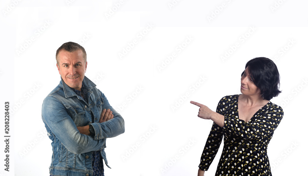 a woman pointing to a man in white a woman pointing to a man in white