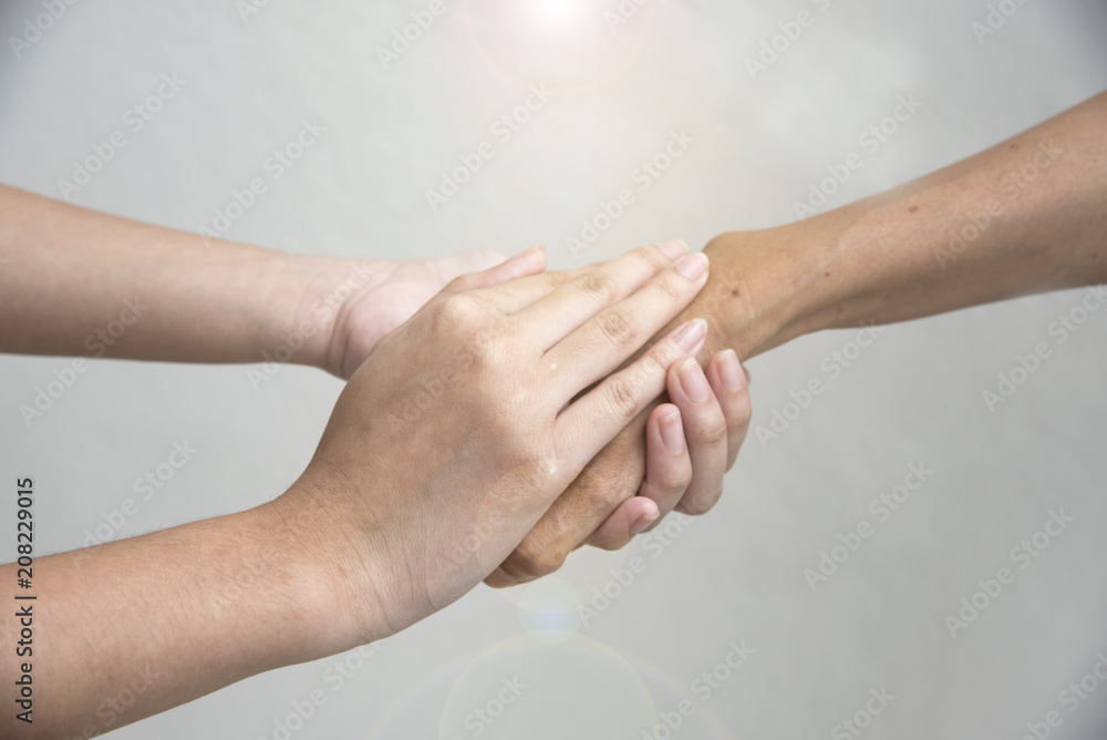 Hand hold togethet in team for success something or take care. Hand hold togethet in team for success something or take care.