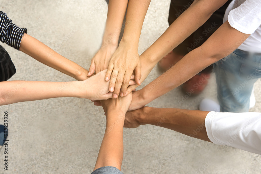 Hand hold togethet in team for success something or take care. Hand hold togethet in team for success something or take care.