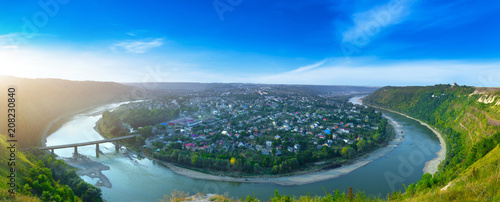 Beautiful evening summer panoramic view of Zalishchyky or Zalischiki, evening view of the town on the bank of the Dniester River meander around city. The province of Bukovina. Ternopil region. Ukraine photo