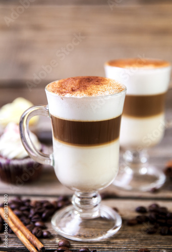 Coffee in glass on the wooden background