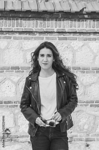 long-haired brunette girl with leather jacket