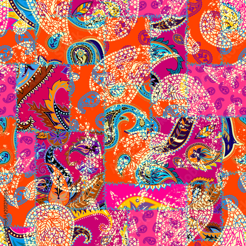 Seamless background pattern. Patchwork pattern with Paisley ornament patterns. Bright magenta and orange colors. Ethnic indian style.