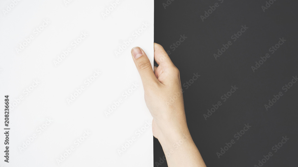 Hand holding blank white paper Hand holding blank white paper