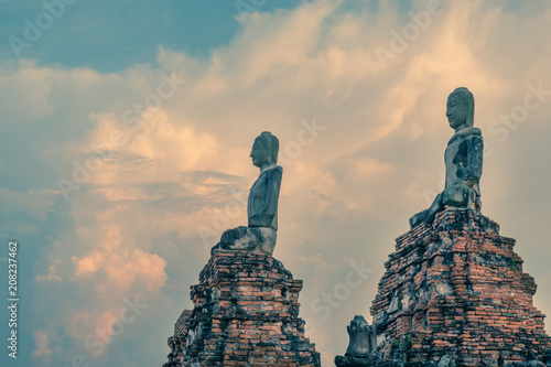 Buddhas at Wat Chaiwatthanaram, Buddhist temple, Ayutthaya Historical Park, Thailand, at sunset