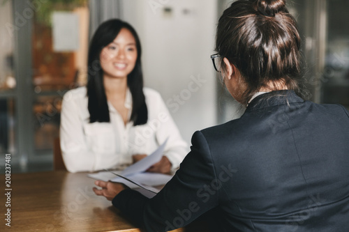 Photos Business, career and placement concept -photo from back of businesswoman intervi