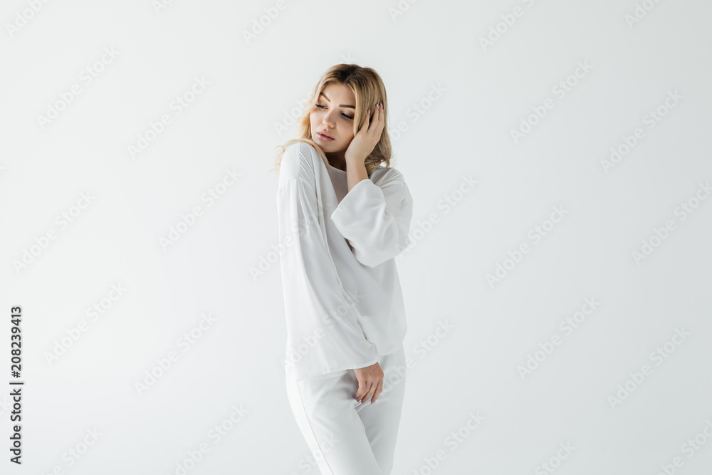 portrait of thoughtful woman in white clothing posing isolated on white portrait of thoughtful woman in white clothing posing isolated on white