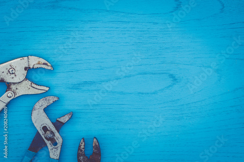 Happy Father's Day still life concept with worn tools on blue board, flat lay in vintage setting