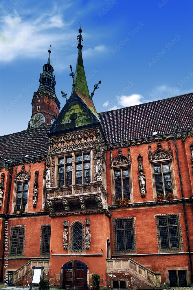 Wroclaw Town Hall at Market Square against bright summer sky. Historical capital of Silesia Poland, Europe. Travel vacation concept