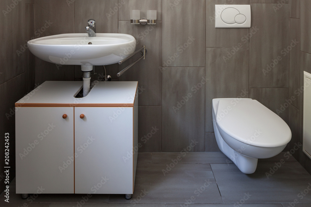 Fototapeta premium Front view bathroom with sink and toilet