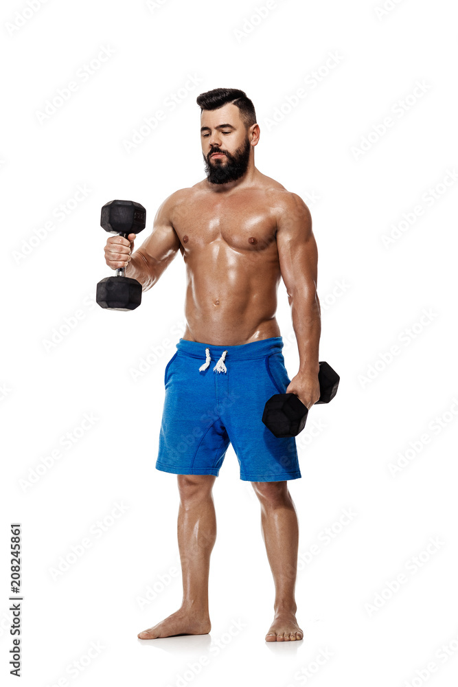 muscular man doing exercises with dumbbells. muscular man doing exercises with dumbbells.