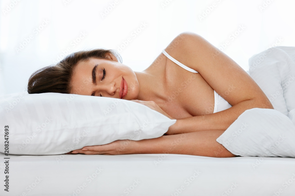 White Bedding. Woman Sleeping On Mattress With Pillow. White Bedding. Woman Sleeping On Mattress With Pillow.