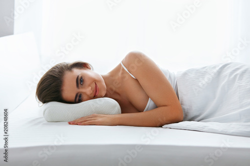 Orthopedic Pillow. Woman Lying In Bed