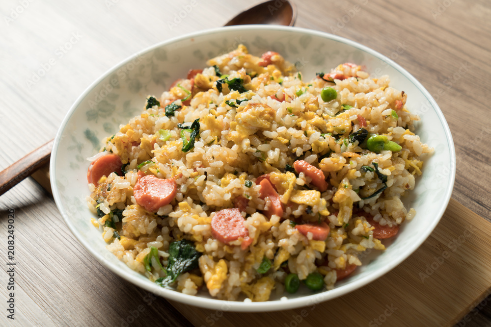 Fried rice with egg and wood grain background Fried rice with egg and wood grain background