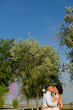 Romanic wedding couple posing in park