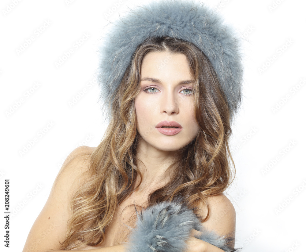 PORTRAIT OF A WOMAN WITH WAVY HAIR BLUE EYES AND FUR HAT PORTRAIT OF A WOMAN WITH WAVY HAIR BLUE EYES AND FUR HAT
