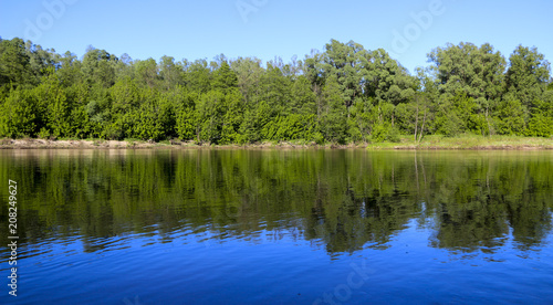 Fototapeta Naklejka Na Ścianę i Meble -  summer landscape. serene nature-green forest, clean river and a small beach.