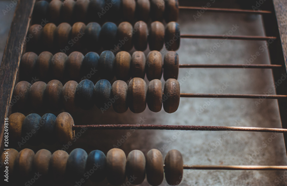 Old wooden abacus laying on the dusty floor of the storage. Closeup Old wooden abacus laying on the dusty floor of the storage. Closeup