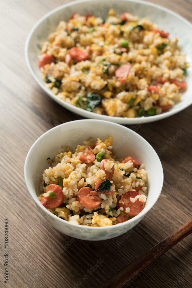 Fried rice with egg and wood grain background Fried rice with egg and wood grain background