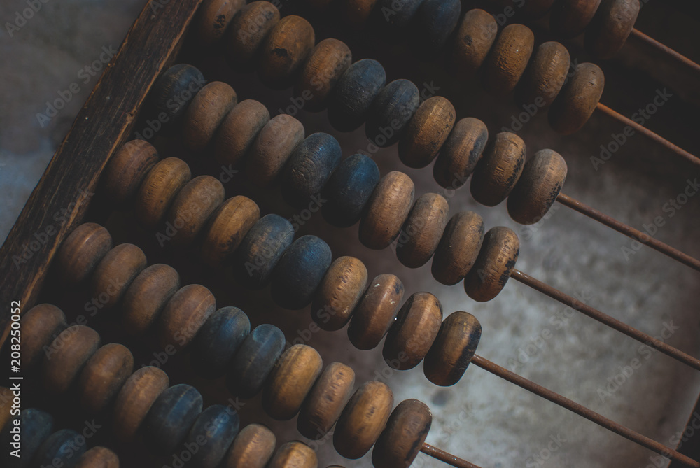 Old wooden abacus laying on the dusty floor of the storage. Closeup Old wooden abacus laying on the dusty floor of the storage. Closeup