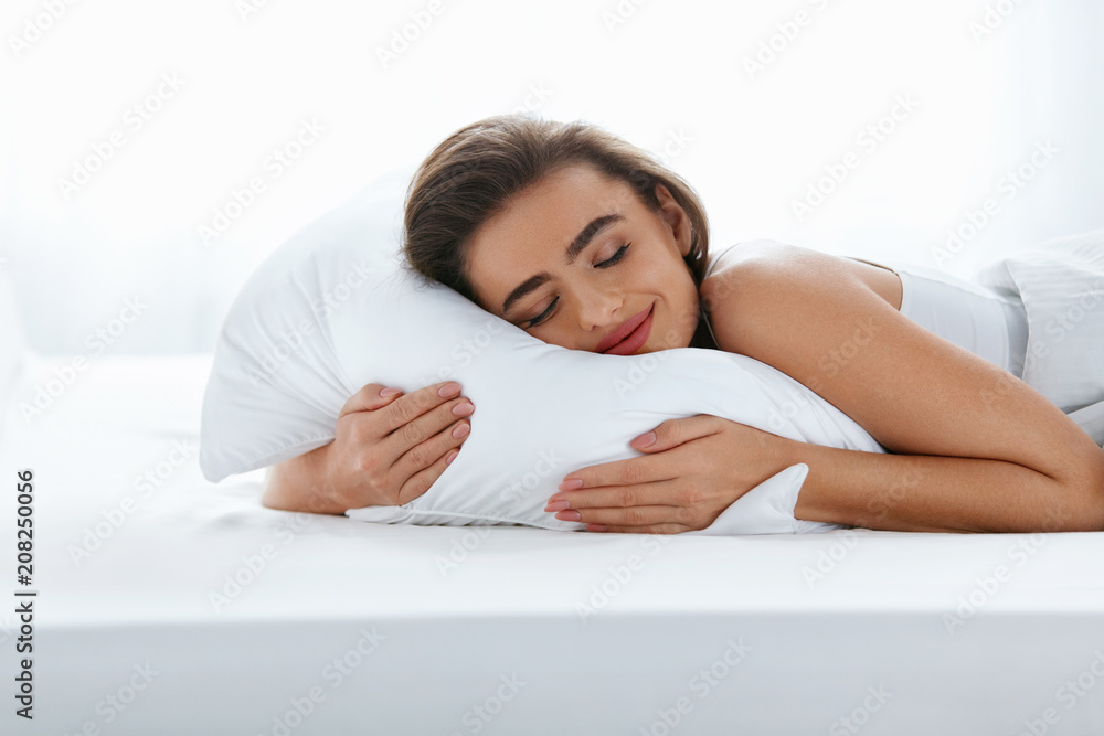 Pillows. Woman Resting On White Pillow Sleeping In Bed Pillows. Woman Resting On White Pillow Sleeping In Bed