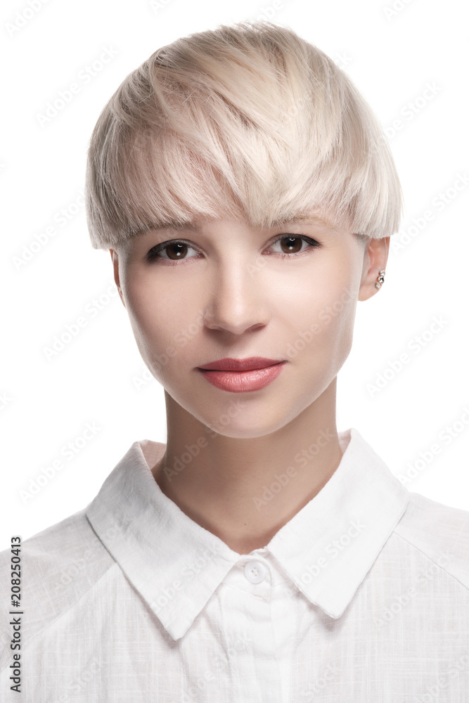 Girl model blonde posing on white background. Short dyed hair, haircut, smooth bangs. White shirt. Girl model blonde posing on white background. Short dyed hair, haircut, smooth bangs. White shirt.