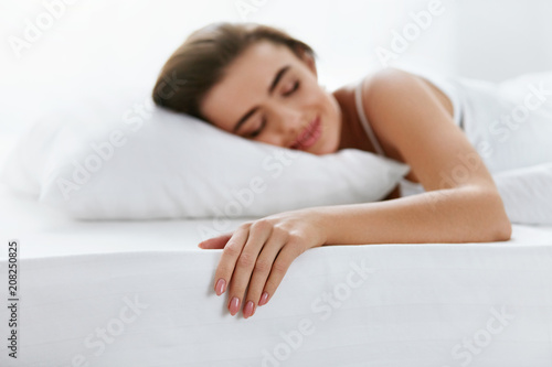 Soft Pillow. Female Sleeping In Bed On White Bedding