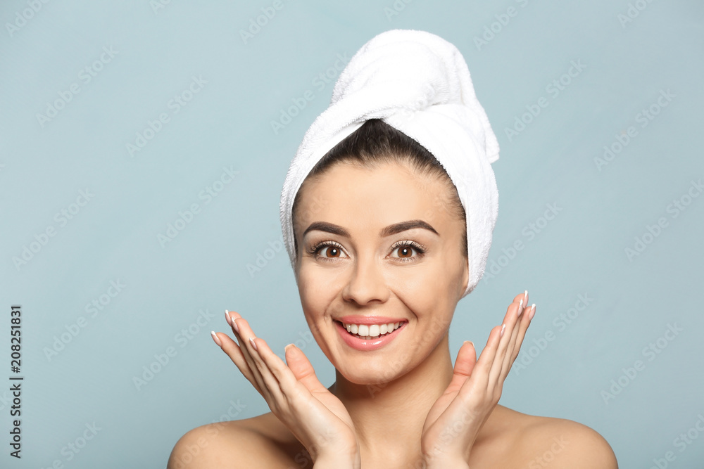 Beautiful young woman with silky skin after spa treatment on color background Beautiful young woman with silky skin after spa treatment on color background