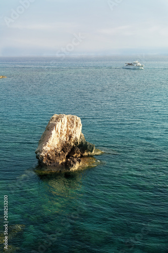 big rock in the clear sea water