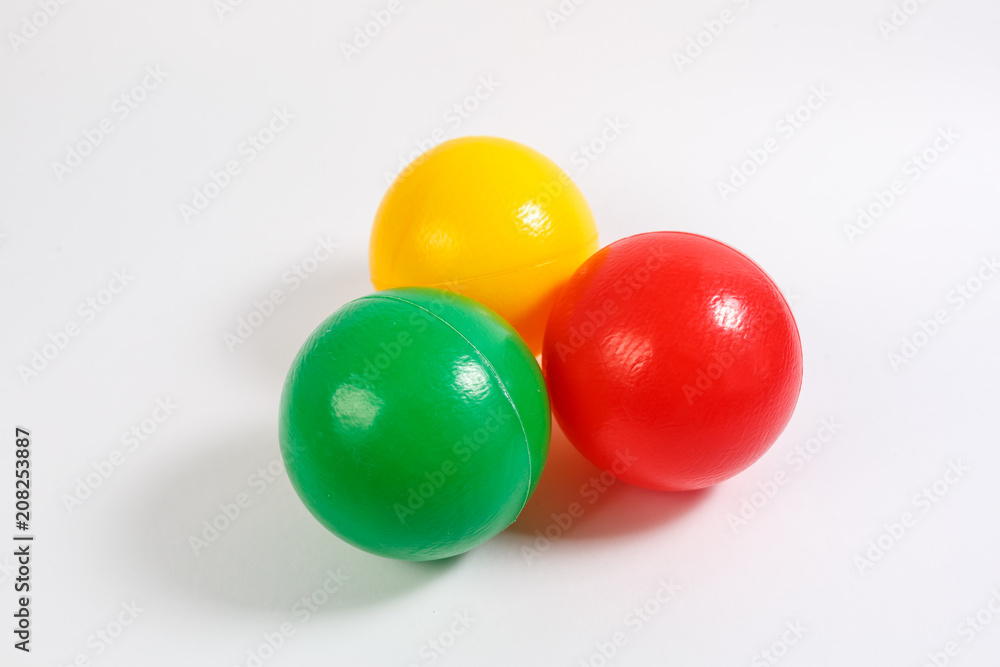 educational kids colored plastic balls toys on white background. educational kids colored plastic balls toys on white background.