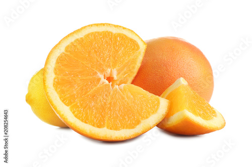 Ripe citrus fruits on white background