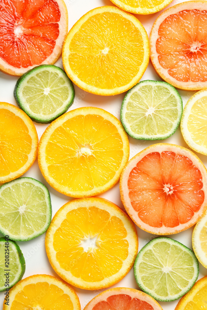 Fototapeta premium Sliced ripe citrus fruits as background