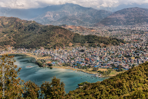 An aerial view of the city of Pokhara in central Nepal.  Pokhara is known as a gateway to the Annapurna Circuit, a popular trail in the Himalayas. photo